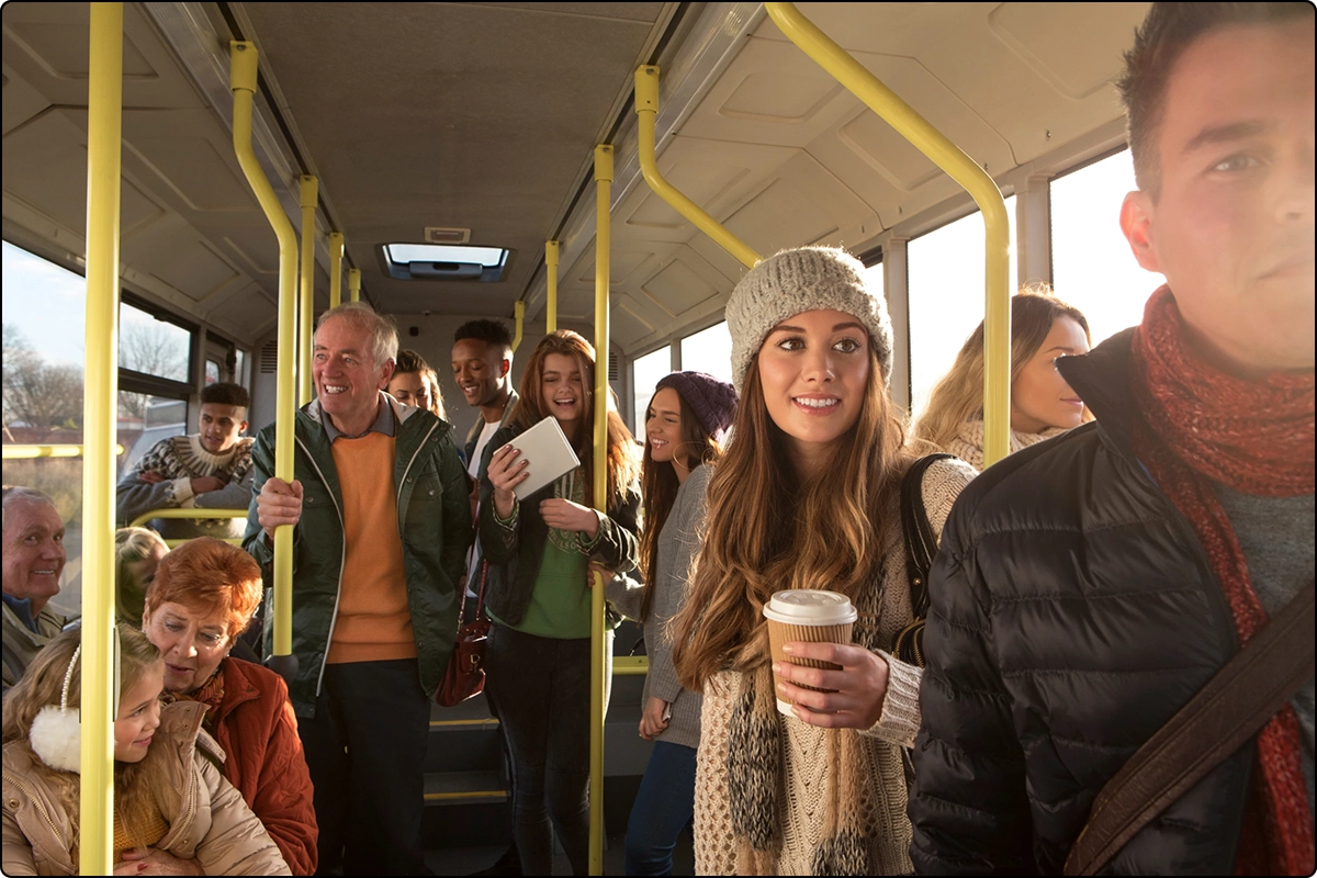 bus full of people of different ages wearing winter clothes blocking sunlight contributing to vitamin d deficiency