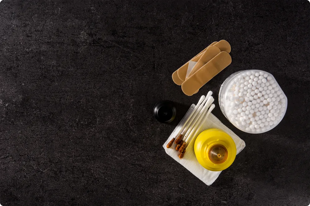 Lugol's iodine solution with bandaids and cotton swabs
